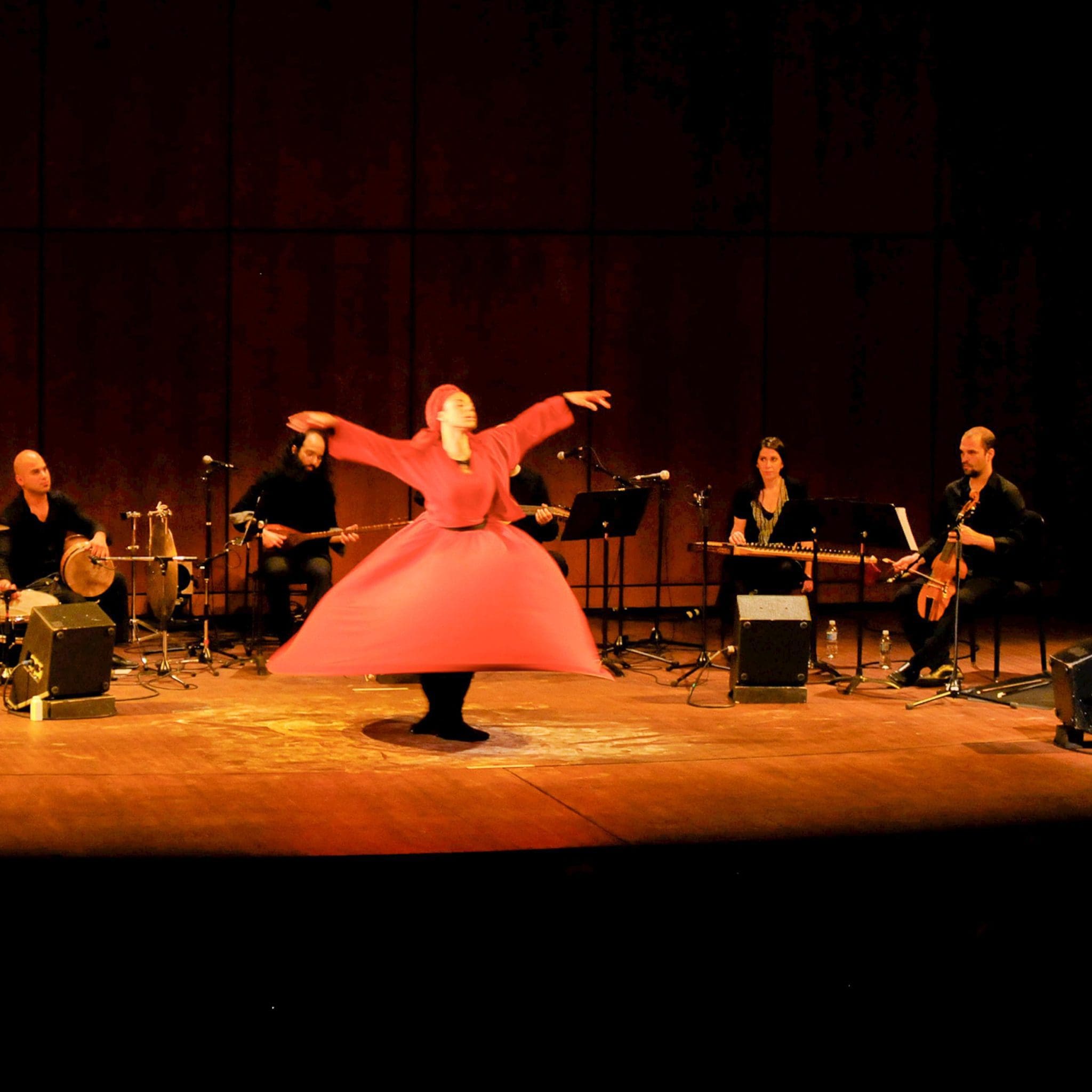 Musicians and whirling dervish on stage